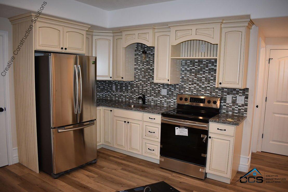 An image of a Utah finished basement kitchenetes bars. A logo for CCS Creative Construction Solutions of Utah is in the bottom right-hand corner.