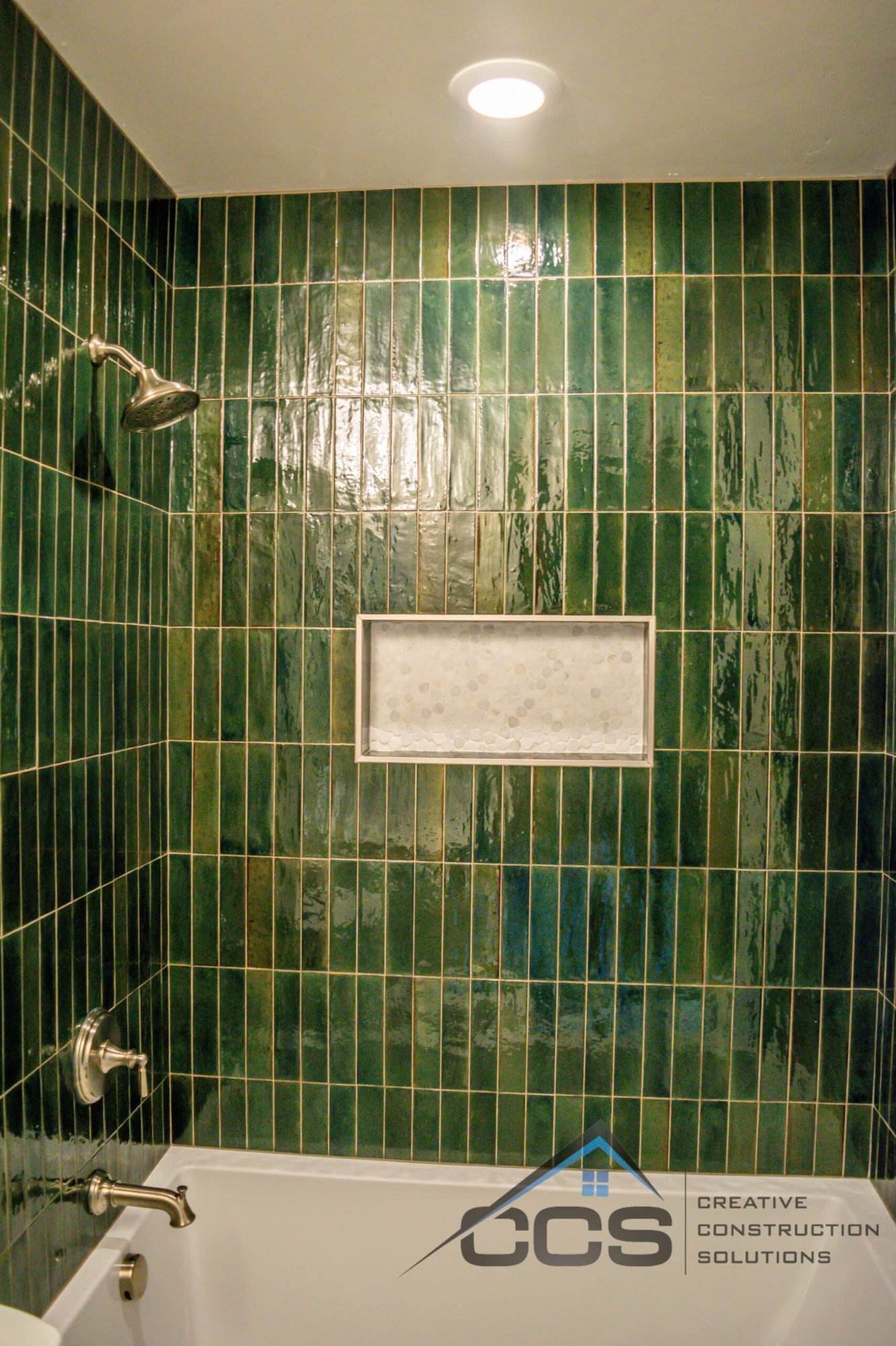 An image of a Utah basement bathroom. A logo for CCS Creative Construction Solutions of Utah is in the bottom right-hand corner.