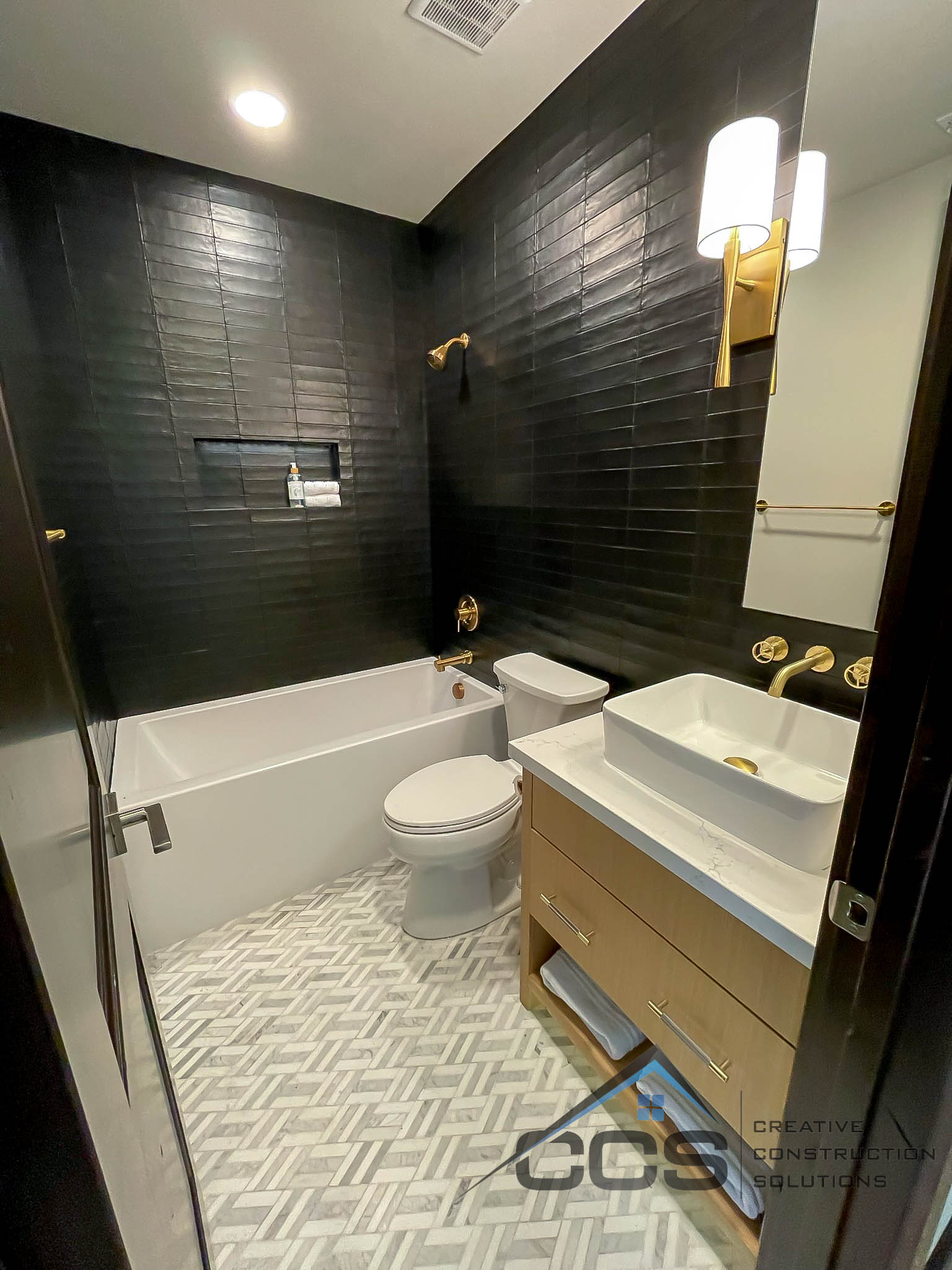 An image of a Utah basement bathroom. A logo for CCS Creative Construction Solutions of Utah is in the bottom right-hand corner.