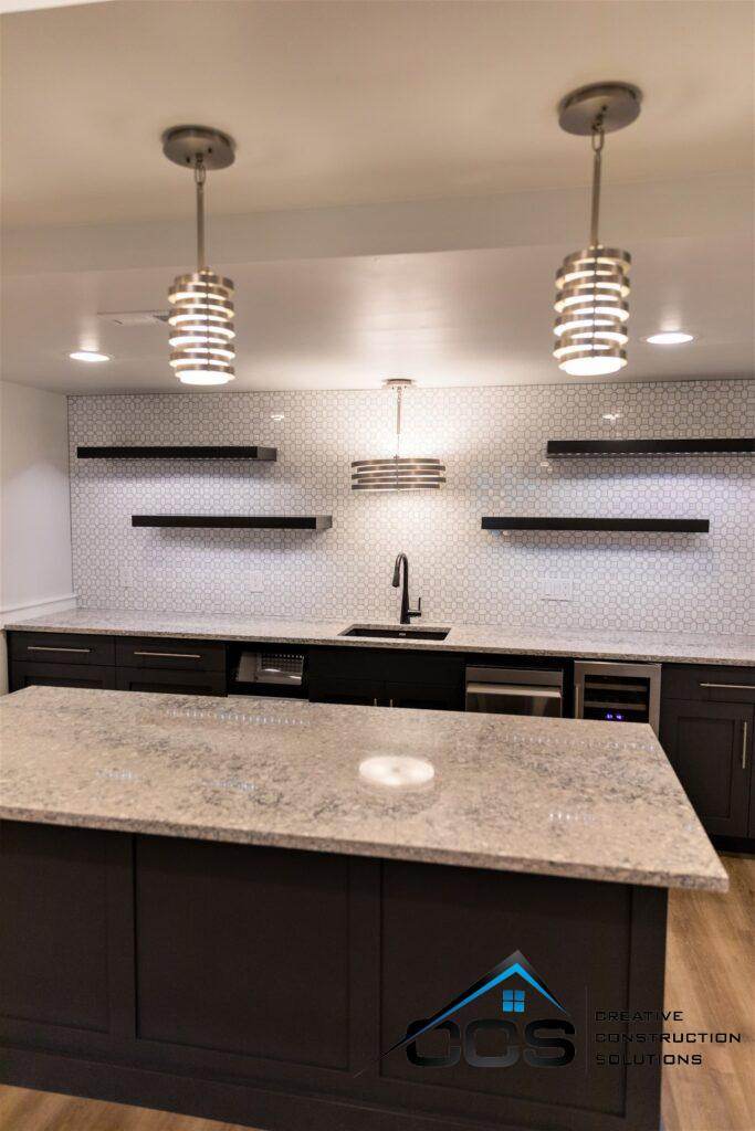 An image of a Utah basement. A logo for CCS Creative Construction Solutions of Utah is in the bottom right-hand corner.