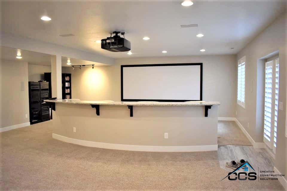 An image of a Utah basement. A logo for CCS Creative Construction Solutions of Utah is in the bottom right-hand corner.